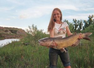 Lady with large catfish caught while Catfishing Musselshell River