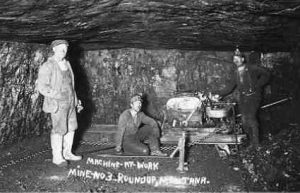 Old Coal Mine historic image with three miners underground