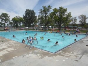 Kids swimming and playing at the Pool and Park in Roundup