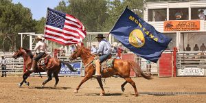 Rodeo Roundup introcution with riders and USA and Montana Flags