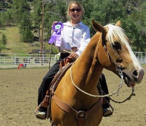 Girl with horse and ribbon at 4H Horse Judging Golden Valley County Musselshell County Montana