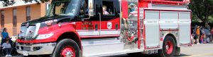 Fire Truck with kids at the Roundup 4th of July Parade